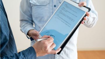 A professional applying a pp signature in a digital form.